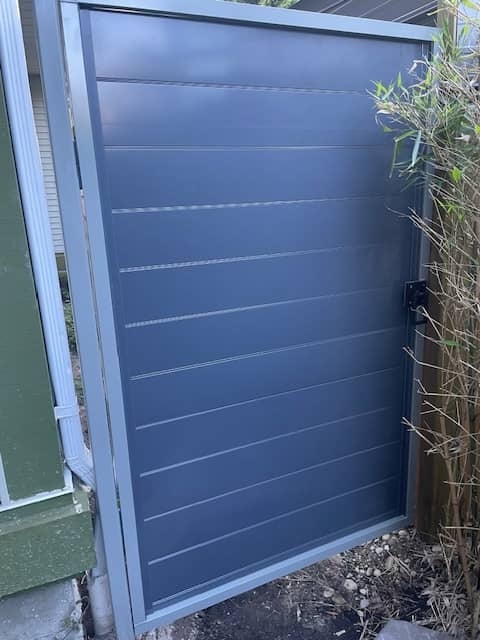 metal panels installation and design of blue fence in Coquitlam