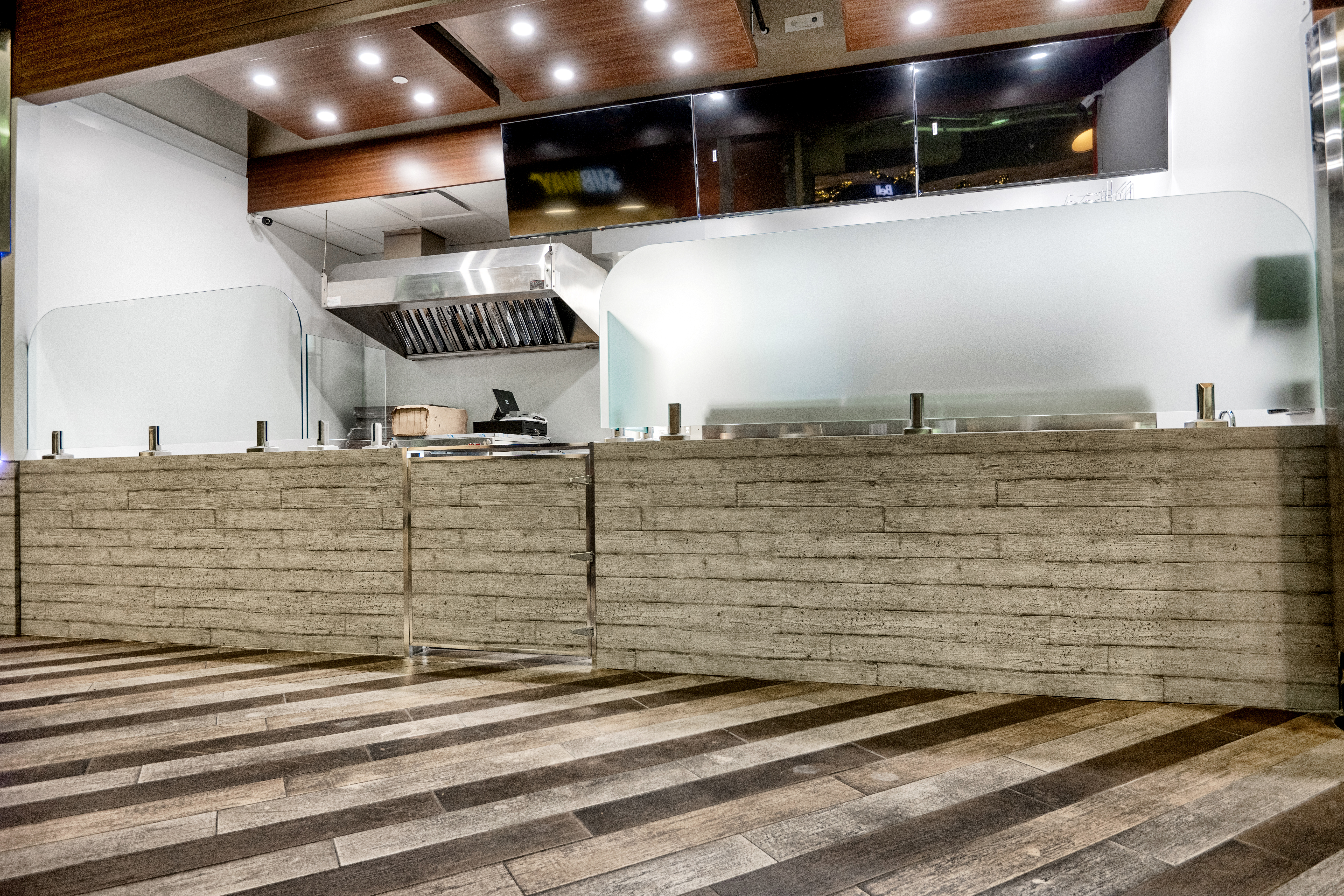 metal panels installation and design of pizza place at the food court in Maple Ridge